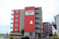 A picture of the Assateague house which is a red hotel.
