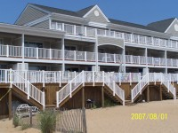 The Beachwalk II property with white railings.